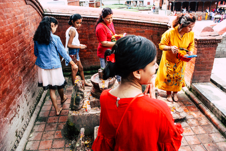 Kathmandu Nepal August 27, 2018 View of unknown Hindu people praying at Pashupatinath temple in the morningのeditorial素材