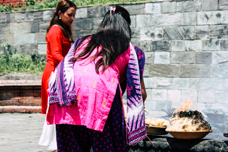 Kathmandu Nepal August 27, 2018 View of unknowns Hindu people making the fire ceremony inside the Pashupatinath temple in the morningのeditorial素材