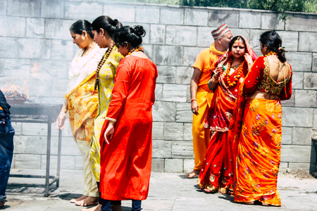 Kathmandu Nepal August 27, 2018 View of unknowns Hindu people making the fire ceremony inside the Pashupatinath temple in the morningのeditorial素材