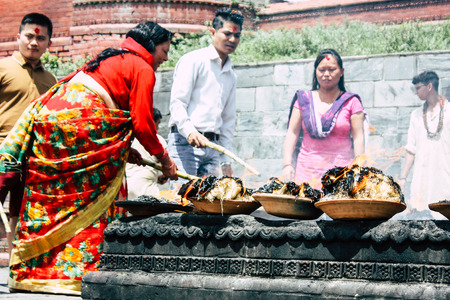 Kathmandu Nepal August 27, 2018 View of unknowns Hindu people making the fire ceremony inside the...