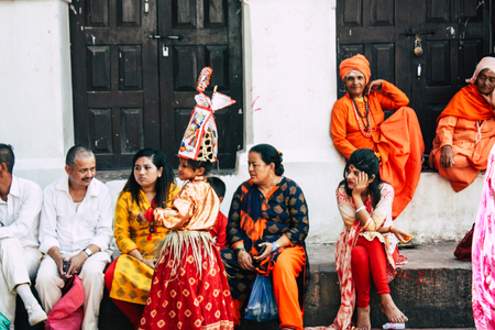 Kathmandu Nepal August 27, 2018 Closeup of unknown Sadhu with orange clothes sitting in the...
