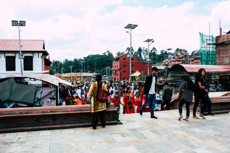 Kathmandu Nepal August 27, 2018 View of unknowns Hindu people visiting the Pashupatinath temple in the morningのeditorial素材