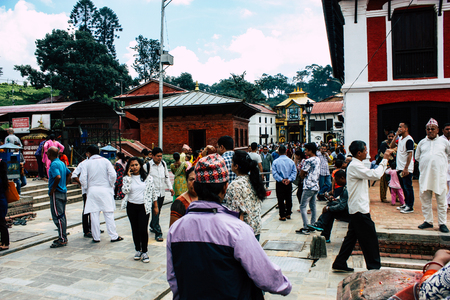 Kathmandu Nepal August 27, 2018 View of unknowns Hindu people visiting the Pashupatinath temple in the morningのeditorial素材