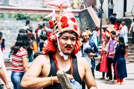 Kathmandu Nepal August 27, 2018 View of unknowns Hindu people attending a religious ceremony at the Pashupatinath temple in the morningのeditorial素材