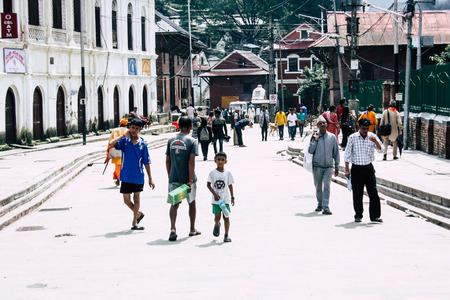 Kathmandu Nepal August 27, 2018 View of unknowns people walking to the entry of the Pashupatinath temple in the morningのeditorial素材