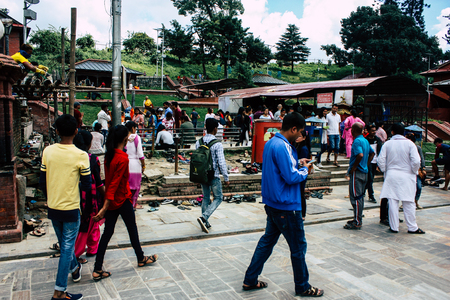 Kathmandu Nepal August 27, 2018 View of unknowns Hindu people visiting the Pashupatinath temple in the morningのeditorial素材