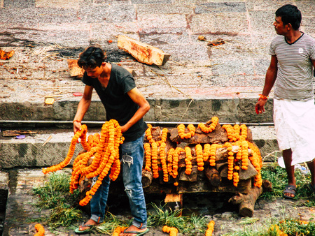 Kathmandu Nepal August 27, 2018 View of unknowns Hindu people preparing the cremation site front the river at the Pashupatinath temple in the afternoonのeditorial素材