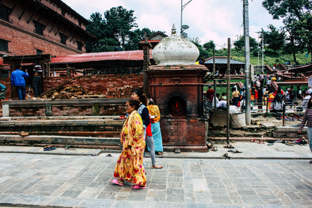 Kathmandu Nepal August 27, 2018 View of unknowns Hindu people visiting the Pashupatinath temple in the morningのeditorial素材