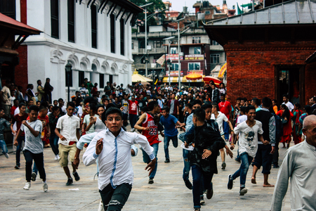 Kathmandu Nepal August 27, 2018 View of young unknowns people attending a religious ceremony where they must run in front of the Hindu demons at the Pashupatinath temple in the morningのeditorial素材