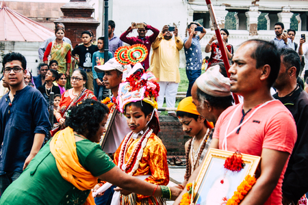 Kathmandu Nepal August 27, 2018 View of unknowns Hindu people attending a religious ceremony at the Pashupatinath temple in the morningのeditorial素材
