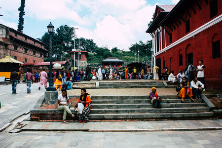 Kathmandu Nepal August 27, 2018 View of unknowns Hindu people visiting the Pashupatinath temple in the morningのeditorial素材