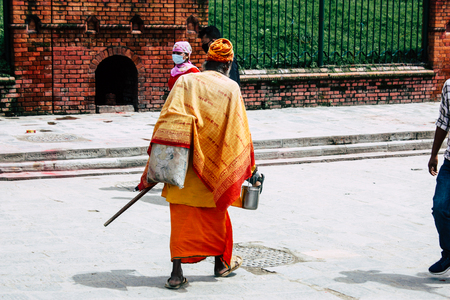 Kathmandu Nepal August 27, 2018 View of unknowns people walking to the entry of the Pashupatinath temple in the morningのeditorial素材