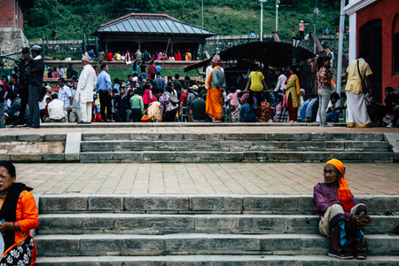 Kathmandu Nepal August 27, 2018 View of unknowns Hindu people visiting the Pashupatinath temple in the morningのeditorial素材
