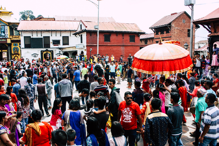 Kathmandu Nepal August 27, 2018 View of unknowns Hindu people attending a religious ceremony at the Pashupatinath temple in the morningのeditorial素材