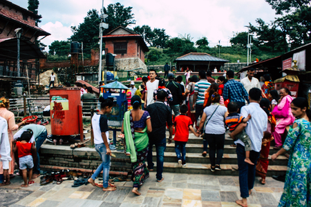 Kathmandu Nepal August 27, 2018 View of unknowns Hindu people visiting the Pashupatinath temple in the morningのeditorial素材