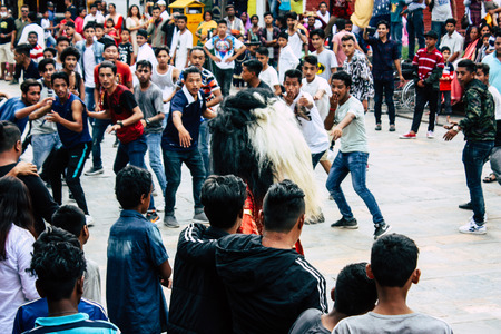 Kathmandu Nepal August 27, 2018 View of young unknowns people attending a religious ceremony where they must run in front of the Hindu demons at the Pashupatinath temple in the morningのeditorial素材