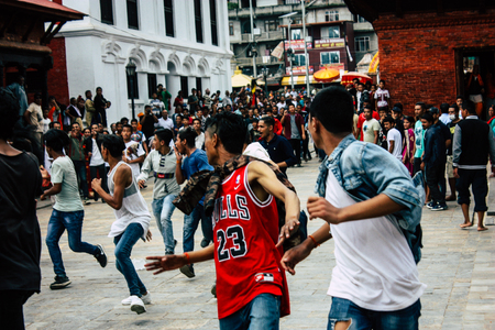 Kathmandu Nepal August 27, 2018 View of young unknowns people attending a religious ceremony where they must run in front of the Hindu demons at the Pashupatinath temple in the morningのeditorial素材