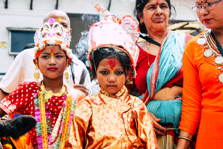 Kathmandu Nepal August 27, 2018 View of unknowns Hindu people attending a religious ceremony with a holy cow at the Pashupatinath temple in the morningのeditorial素材