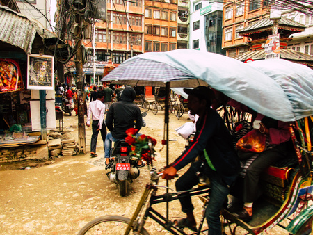 Kathmandu Nepal August 31, 2018 View of a unknown Nepali people driving a local touk touk at Thamel district in Kathmandu in the afternoonのeditorial素材