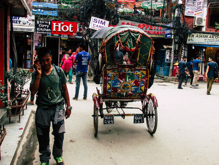 Kathmandu Nepal August 31, 2018 View of a unknown Nepali people driving a local touk touk at Thamel district in Kathmandu in the afternoonのeditorial素材