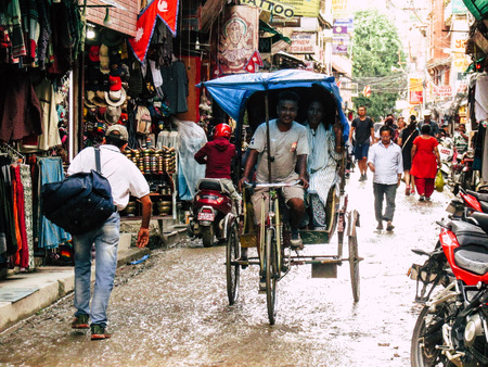Kathmandu Nepal August 31, 2018 View of a unknown Nepali people driving a local touk touk at Thamel district in Kathmandu in the afternoonのeditorial素材