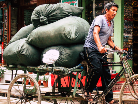 Kathmandu Nepal August 31, 2018 View of a unknown Nepali people driving a local touk touk at Thamel district in Kathmandu in the afternoonのeditorial素材