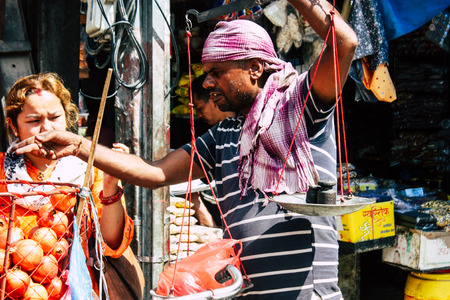 Kathmandu Nepal September 1, 2018 Closeup of a unknown Nepali people selling fruits at the street vegetable market in Chhetrapati square Kathmandu in the morningのeditorial素材