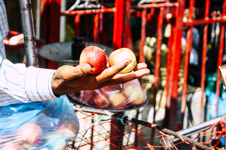 Kathmandu Nepal September 1, 2018 Closeup of a hand of unknown Nepali people selling fruits at the street vegetable market in Chhetrapati square Kathmandu in the morningのeditorial素材