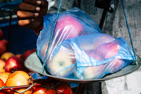 Kathmandu Nepal September 1, 2018 Closeup of a scale of a unknown Nepali people selling fruits at the street vegetable market in Chhetrapati square Kathmandu in the morningのeditorial素材