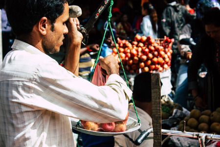 Kathmandu Nepal September 1, 2018 Closeup of a unknown Nepali people selling fruits at the street vegetable market in Chhetrapati square Kathmandu in the morningのeditorial素材
