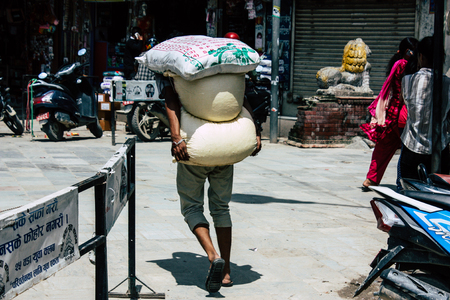 Kathmandu Nepal September 1, 2018 View of traditional Nepali porter walking in the street of Kathmandu in Nepalのeditorial素材