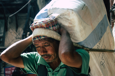 Kathmandu Nepal September 1, 2018 View of traditional Nepali porter walking in the street of Kathmandu in Nepalのeditorial素材