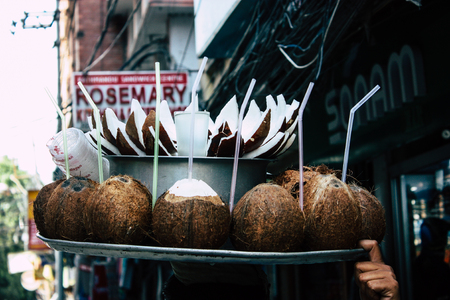 Kathmandu Nepal September 5, 2018 Closeup of a Nepalese street vendor working to sell coconuts in the streets of Kathmandu in the morningのeditorial素材