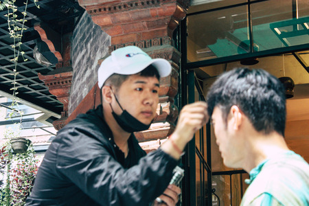 Kathmandu Nepal September 7, 2018 View of the actors makeup team of a Chinese action film of which certain shots are made in the neighborhood of Thamel in Kathmandu in the morningのeditorial素材