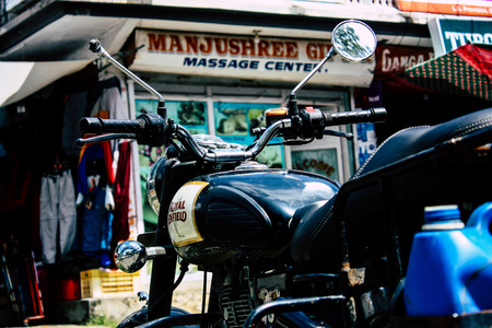 Pokhara Nepal September 12, 2018 Closeup of a Royal Enfield motorcycle parked in the street of Pokhara in the afternoonのeditorial素材
