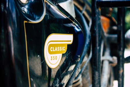 Pokhara Nepal September 12, 2018 Closeup of a Royal Enfield motorcycle parked in the street of Pokhara in the afternoonのeditorial素材