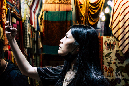 Kathmandu Nepal September 13, 2018 Portrait of unknown Nepalese people walking in the street of Kathmandu in the afternoonのeditorial素材