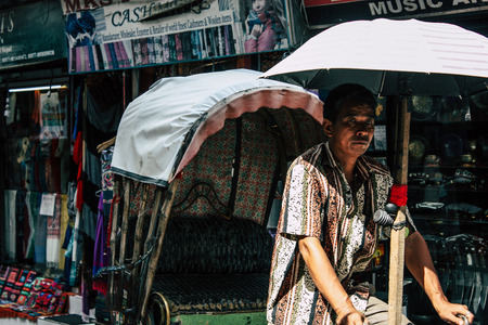 Kathmandu Nepal September 10, 2018 View of unknown Nepali people driving a touk touk in Thamel street in Kathmandu in the morningのeditorial素材