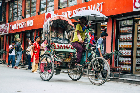 Kathmandu Nepal September 10, 2018 View of unknown Nepali people driving a touk touk in Thamel street in Kathmandu in the morningのeditorial素材