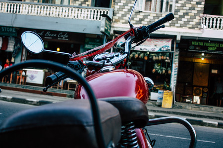 Pokhara Nepal September 18, 2018 Closeup of a Royal Enfield motorcycle parked in the street of Pokhara in the afternoonのeditorial素材