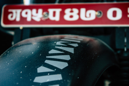 Pokhara Nepal September 18, 2018 Closeup of a Royal Enfield motorcycle parked in the street of Pokhara in the afternoonのeditorial素材