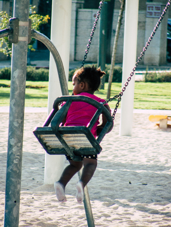 Jerusalem Israel September 11, 2018 View of kids playing in a public garden in Jerusalem in the afternoonのeditorial素材