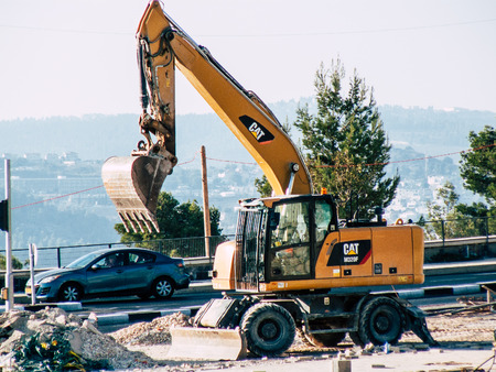 Jerusalem Israel September 10, 2018 View of a yellow truck in a construction site near Jerusalem in the afternoonのeditorial素材