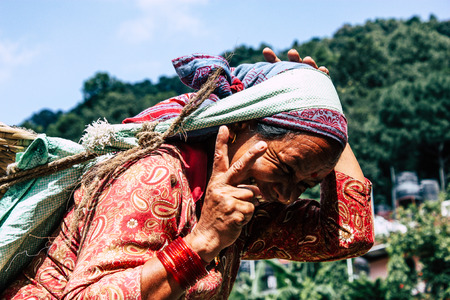 Pokhara Nepal September 23, 2018 Closeup of Nepalese porter carrying sand for construction of a new house in Pokara Lakeside in the afternoonのeditorial素材