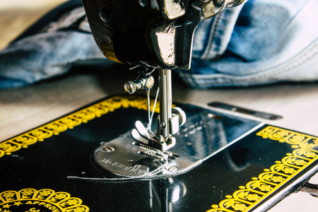 Pokhara Nepal September 25, 2018 Closeup of an old pedal sewing machine of a Nepalese tailor working...
