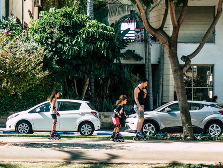 Tel Aviv Israel September 28, 2018 View of unknown Israeli people with two children in roller skates...