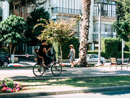 Tel Aviv Israel September 28, 2018 View of unknown Israeli people riding a bicycle in the center of Tel Aviv in the morningのeditorial素材