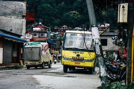 Pokhara Nepal October 4, 2018 View of a traditional Nepali yellow school bus driving in New street...