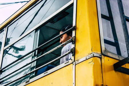 Pokhara Nepal October 4, 2018 Portrait of children coming from the school in a traditional Nepalese school bus at Pokhara in the afternoonのeditorial素材