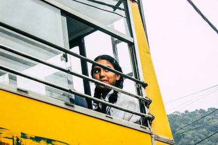 Pokhara Nepal October 4, 2018 Portrait of children coming from the school in a traditional Nepalese school bus at Pokhara in the afternoonのeditorial素材